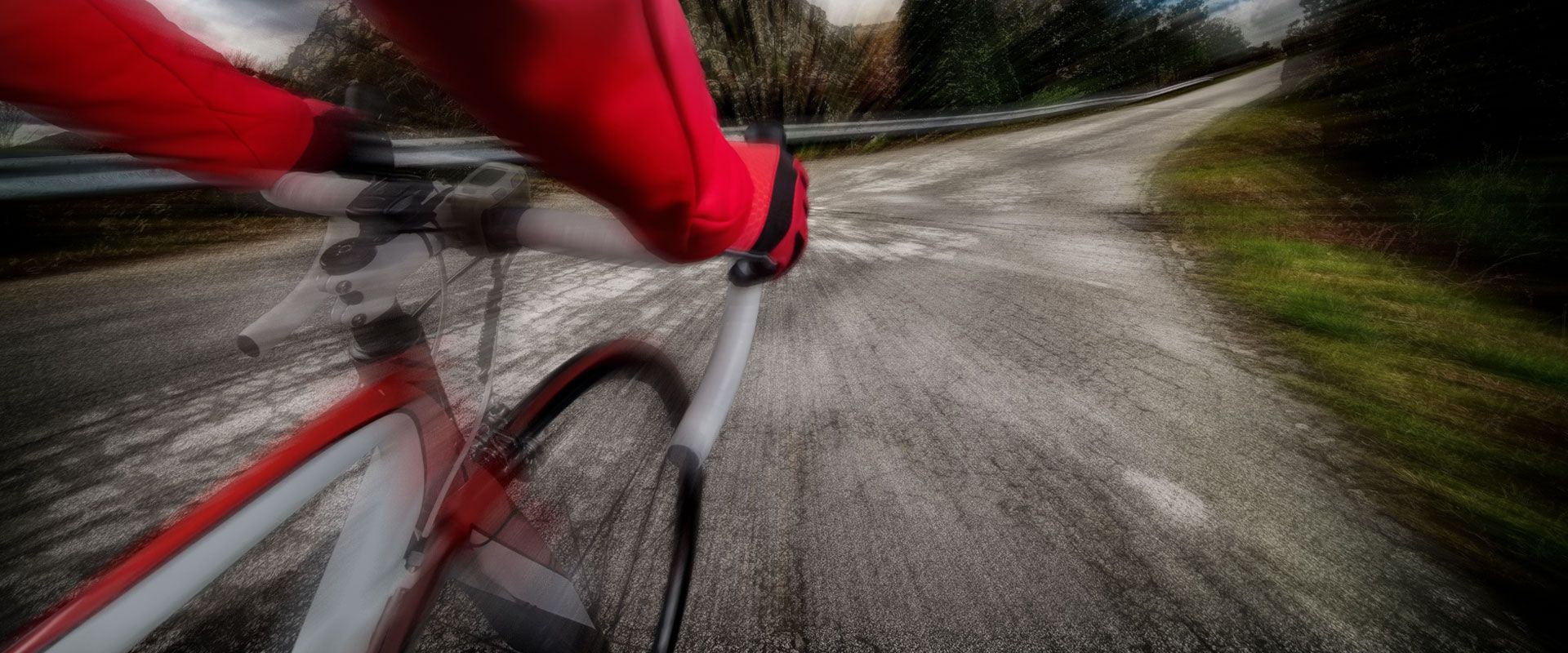 Speeding bicycle traveling on downhill bike path.